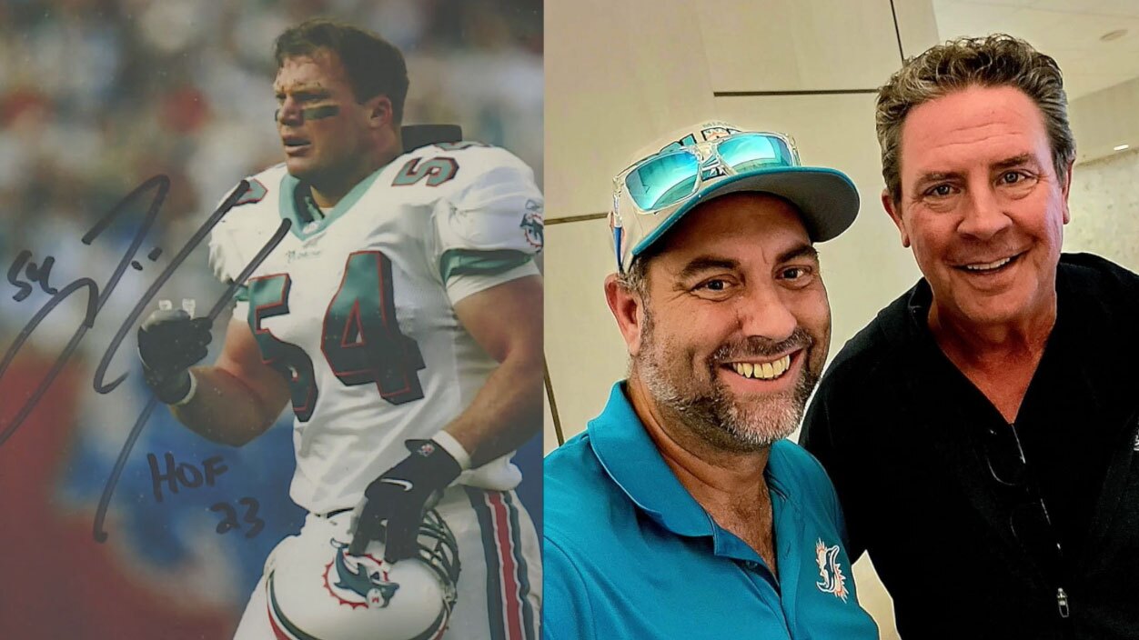 Jonathan Jenkins has an autographed picture of former Dolphins linebacker Zach Thomas and a picture with former quarterback Dan Marino.